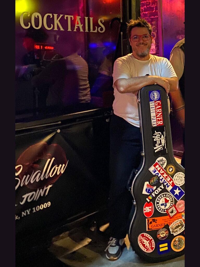 Whit NYC with guitar